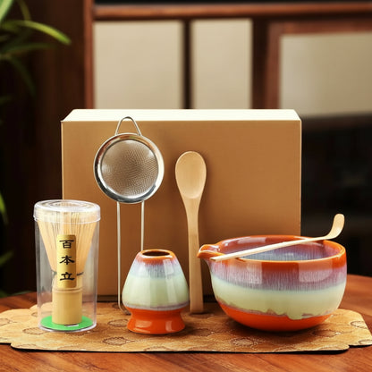 6 piece matcha Tea-making set with warm autumn hues on bowel and matcha cup on a wooden surface