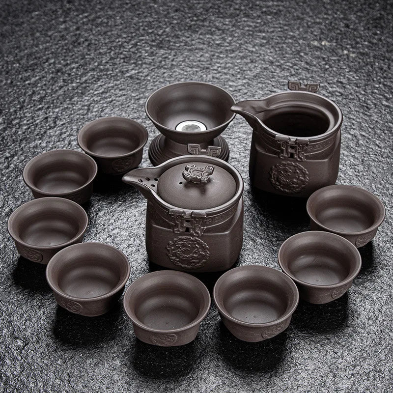 Dragon 11pcs Tea set with a pot and multiple cups on a textured surface
