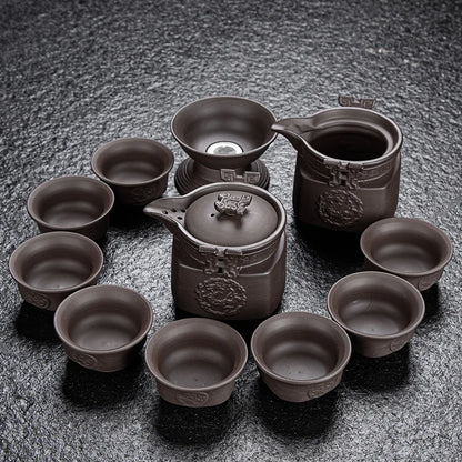 Dragon 11pcs Tea set with a pot and multiple cups on a textured surface