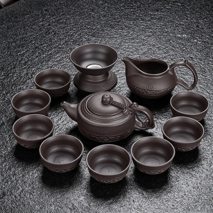 11 pcs Jingde tea set on a dark textured surface