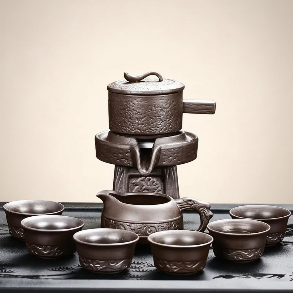 Ceramic tea set with teapot, teacup, and small pot on a dark background